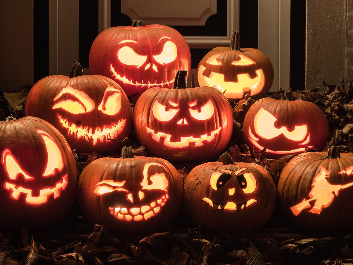 Carved Halloween pumpkins glowing in the dark